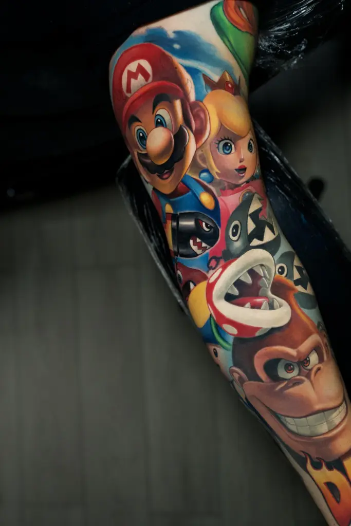 Donkey Kong & Princess Peach color realism tattoo by Pablo Frias