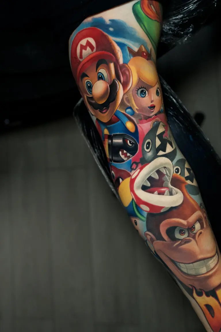 Donkey Kong & Princess Peach color realism tattoo by Pablo Frias