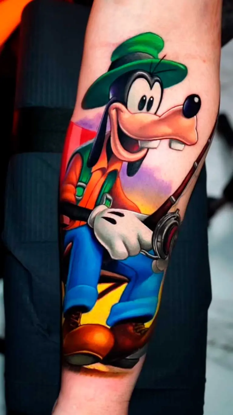 Goofy cartoon tattoo on forearm by Pablo Frias